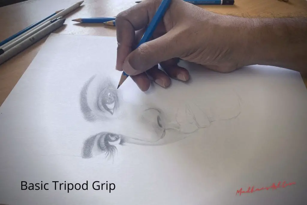 A hand drawing a female face with basic tripod grip, showing how to hold a pencil when drawing