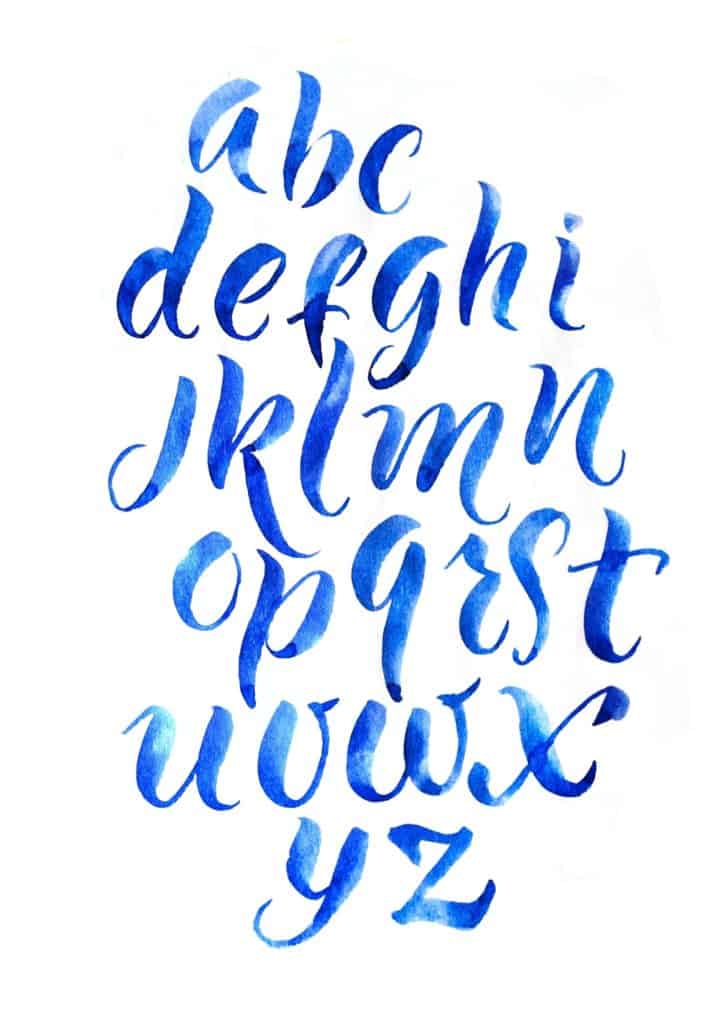 Calligraphy letter written using a brush pen with blue color