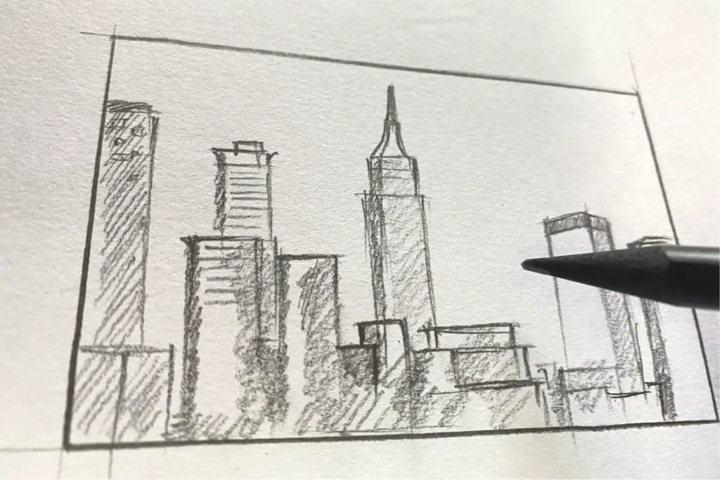 thumbnail sketch of a city sky scraper and a pencil