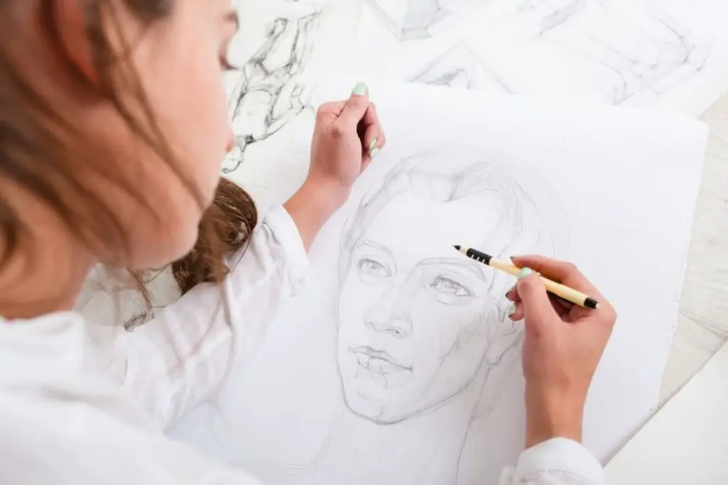 a lady doing pencil artwork