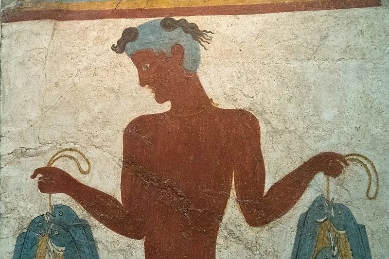 Image of a man with Fish in both the hands done using fresco painting