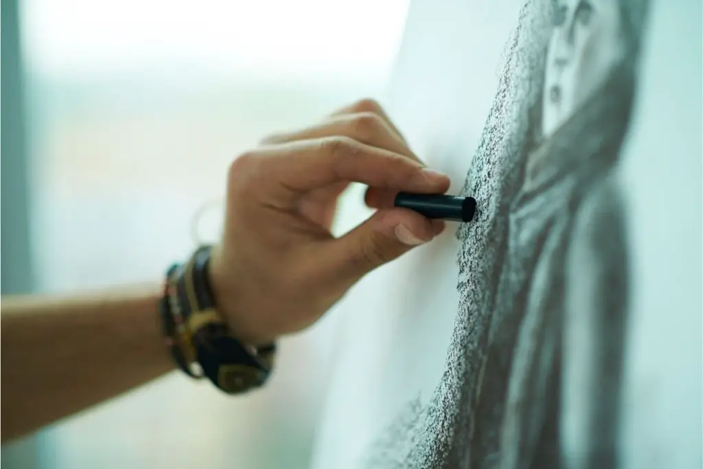 An artist drawing using oil pastel of an american women