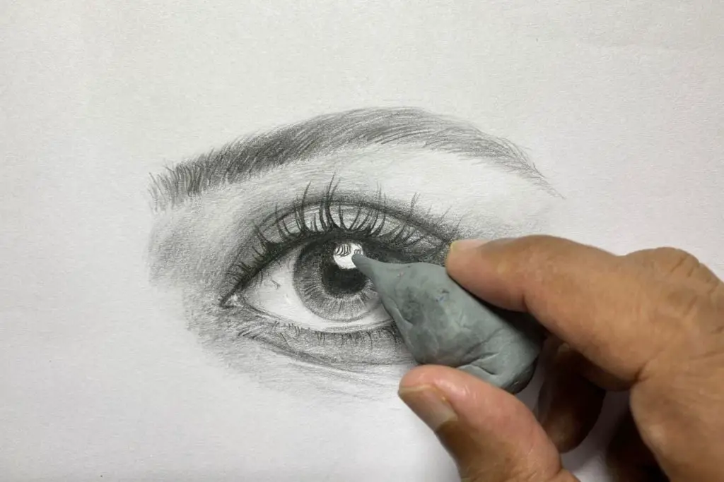 pencil drawing of an eye depicting how to use kneaded eraser