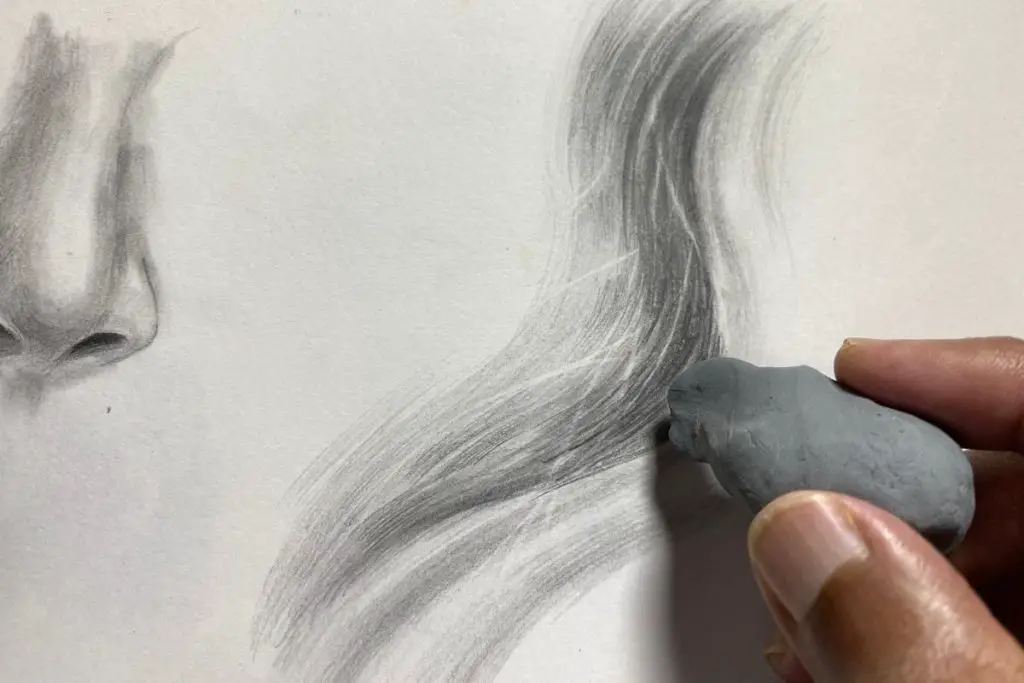 pencil drawing of hair, finger erasing using kneaded eraser
