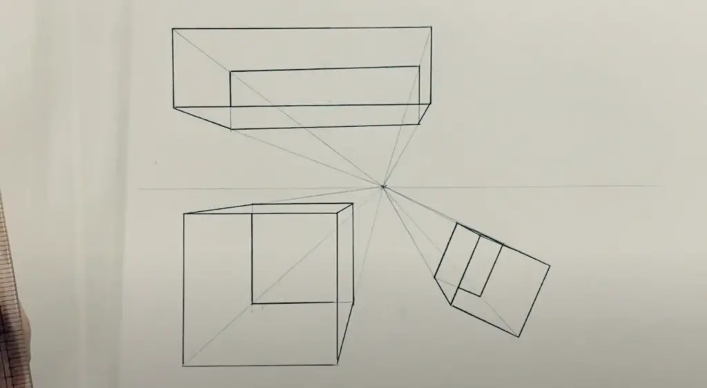 A Cube, Box and another Cube in different angle all converging towards Vanishing Point