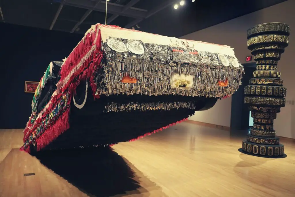 A car lifted on one side kept as a decorative art in an art museum