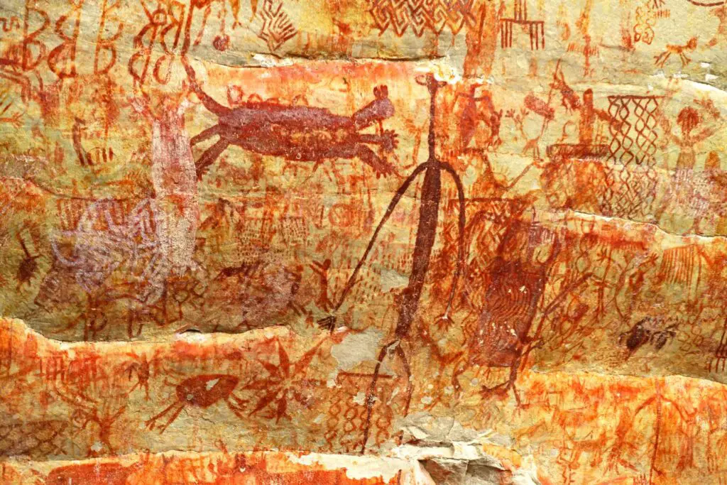 Ancient Cave painting on the wall, animals, humans, and lot of other images